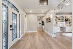 Foyer entrance featuring light hardwood / wood-style flooring