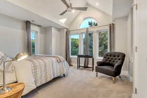 Bedroom featuring high vaulted ceiling, ceiling fan, and carpet floors