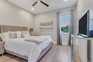 Bedroom featuring ceiling fan and light hardwood / wood-style floors