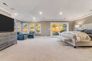 Carpeted bedroom with vaulted ceiling, ornamental molding, and access to exterior