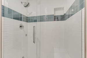 Bathroom featuring tiled shower