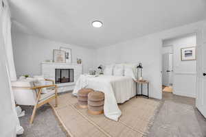 Primary bedroom 3 featuring a fireplace great for cozying up next to.