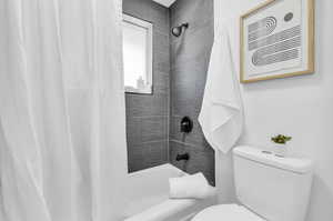 Jack & Jill Bathroom featuring dual sinks, shower / tub combo. Connects to bedroom 2