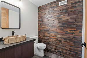 Petrified wood sink, antique wood panel wall