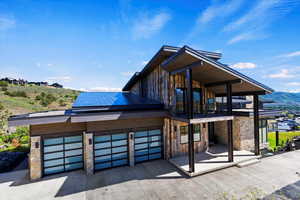 Metal/glass garage doors, custom metal grand front door