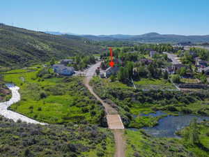 Aerial view featuring a water and mountain view