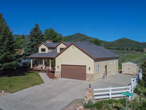 View of front of house featuring a garage and a mountain view