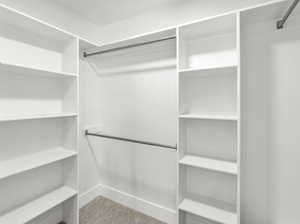 Walk in closet featuring carpet floors