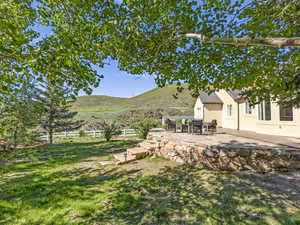 View of yard featuring a patio and a mountain view