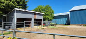 View of stable featuring an outdoor structure