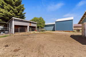 View of stable with an outdoor structure