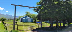 View of yard featuring a mountain view and a shed