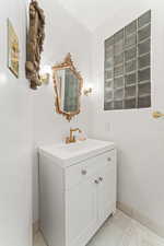 Guest bathroom in Foyer.