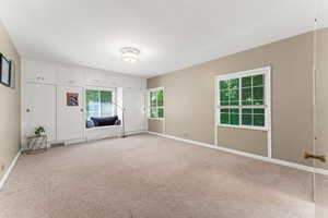 Large upstairs bedroom with built in cabinetry.