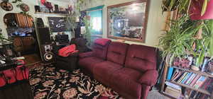 Living room with hardwood / wood-style flooring