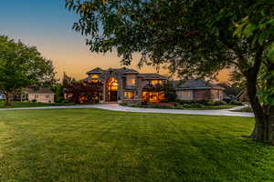 View of front of property with a yard