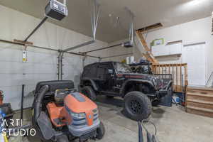 Garage featuring a garage door opener