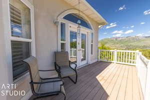 Wooden terrace with a mountain view and french doors