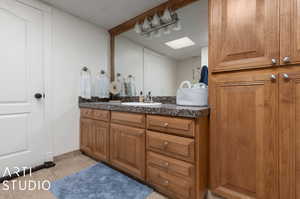 Bathroom featuring tile floors and oversized vanity