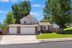 Welcome home! Large corner lot with mature trees and sweeping lawn.