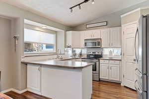 Bright kitchen with plenty of counterspace and sight lines to the dining area and the family room.