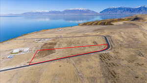 Aerial view featuring a water and mountain view