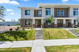 View of front of property with a front yard