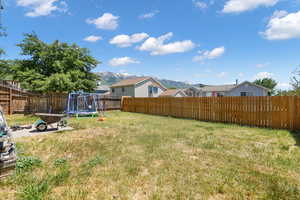 View of yard with a mountain view and a trampoline