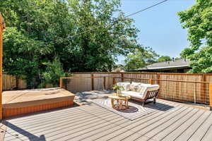 Wooden deck featuring an outdoor living space