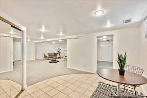 Dining area featuring light tile floors