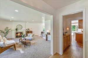 Living room with tile flooring and a fireplace