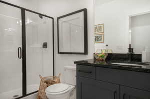 Bathroom with oversized vanity and toilet