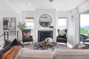 Living room featuring a tiled fireplace