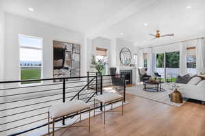 Living room featuring light wood-type flooring and ceiling fan