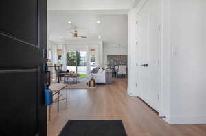 Entryway with light hardwood / wood-style floors and ceiling fan