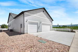 Garage featuring central air condition unit