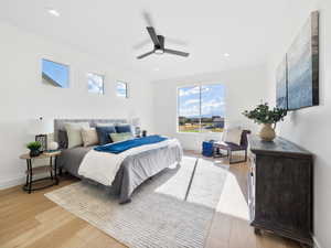 Bedroom with light wood-type flooring and ceiling fan