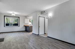 Unfurnished room featuring light wood-type flooring