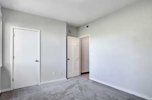 Unfurnished bedroom with carpet floors