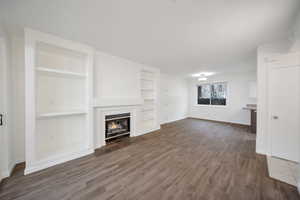 Dining area with hardwood / wood-style floors