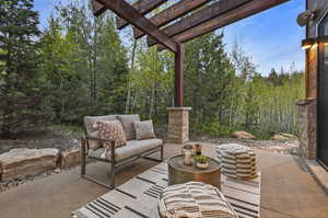 View of patio with a pergola and outdoor lounge area