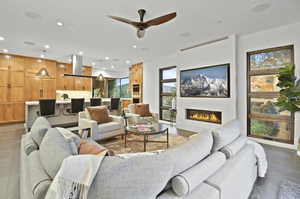 Living room with tile flooring and ceiling fan