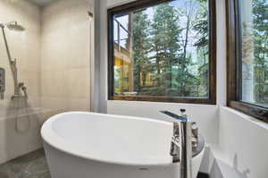 Bathroom featuring tile flooring and a bathing tub