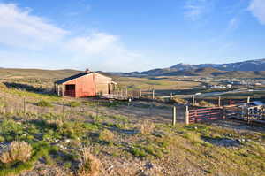 Property view of mountains with a rural view