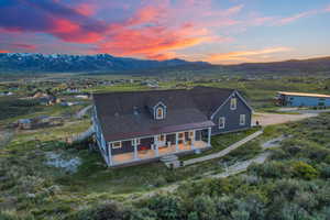 Aerial view at dusk featuring a mountain view