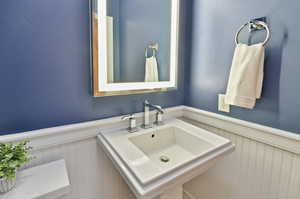 Bathroom featuring sink and toilet