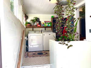 Light bright laundry room/back entry. Steps to full yet to be finished basement.