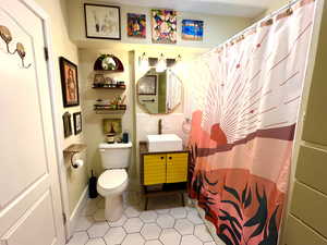 Unique raised sink with decorative faucet.