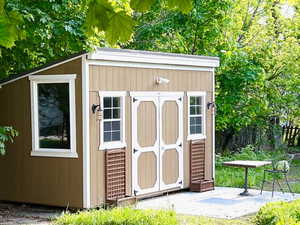 Large wired shed with big windows intended to be an art studio.