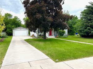 Ample parking with 2 car garage. Lush manicured lawn.